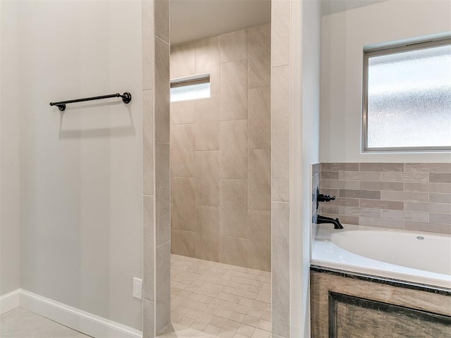 bathroom with tile patterned flooring and independent shower and bath