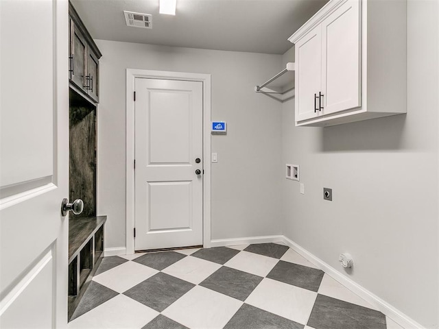 clothes washing area featuring cabinets, washer hookup, and hookup for an electric dryer