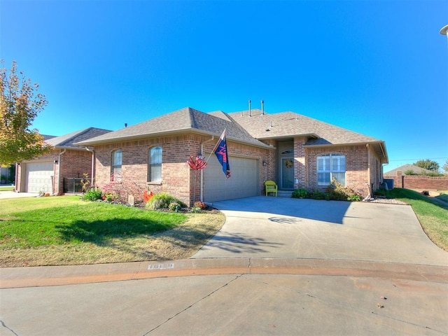 ranch-style house with a garage and a front yard