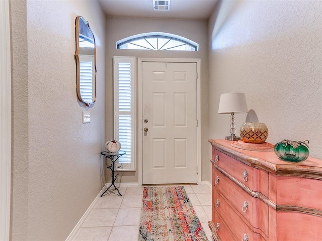 foyer entrance featuring light tile patterned flooring