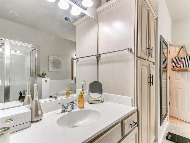 bathroom with vanity, tile patterned floors, and a shower with shower door