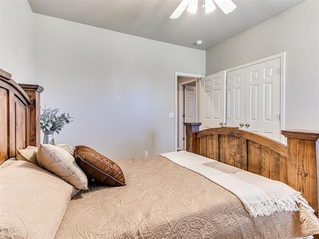 bedroom with ceiling fan and a closet