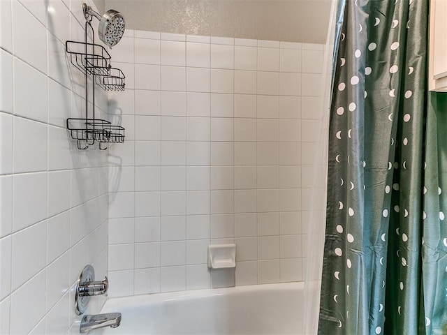 bathroom featuring shower / tub combo with curtain