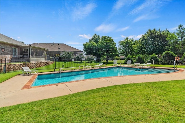 view of pool featuring a yard