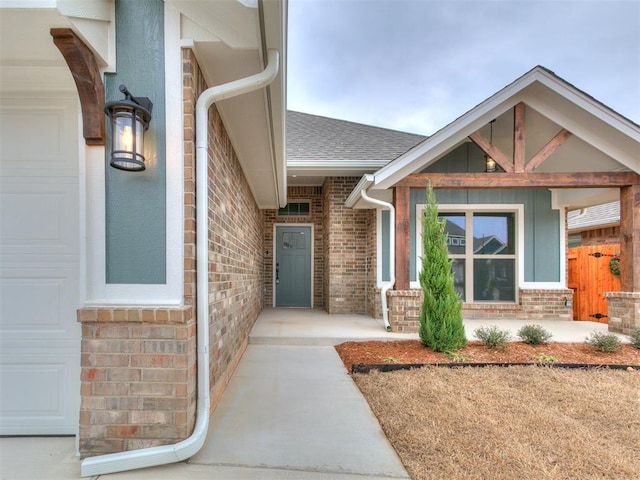 view of exterior entry with a garage