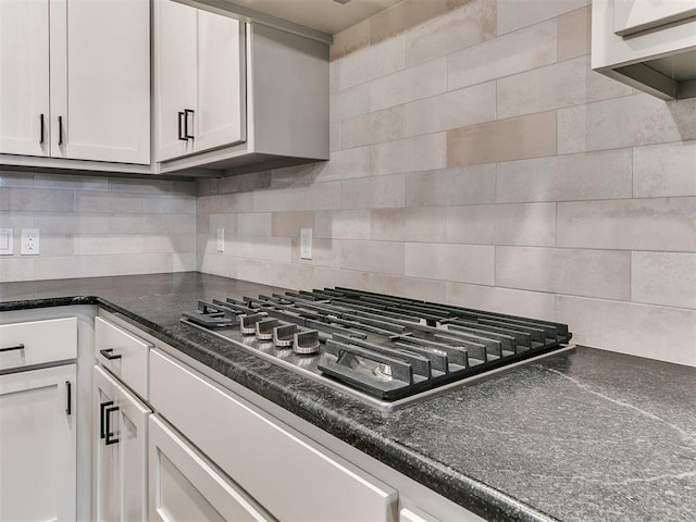 kitchen featuring tasteful backsplash, white cabinetry, and stainless steel gas cooktop