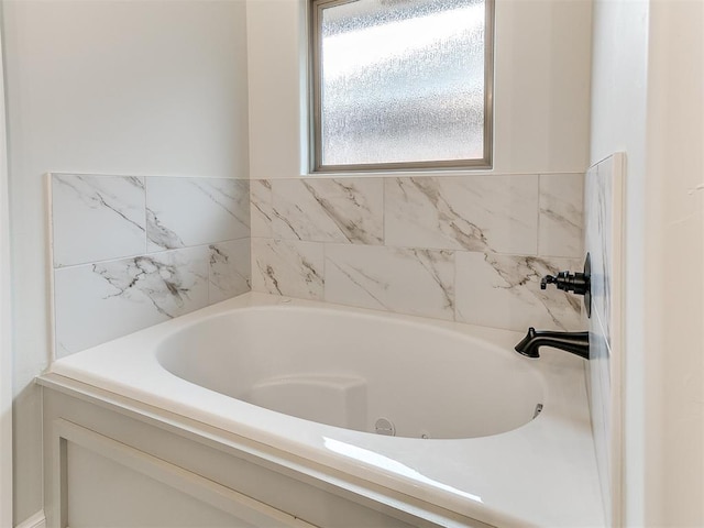 bathroom featuring a tub to relax in