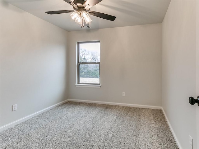 empty room featuring carpet flooring and ceiling fan