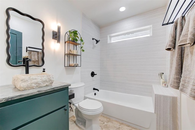 full bathroom featuring vanity, toilet, and tiled shower / bath combo