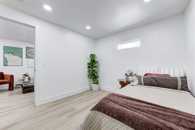 bedroom with light hardwood / wood-style floors