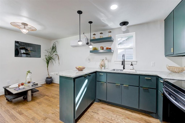 kitchen with sink, electric range, light hardwood / wood-style floors, blue cabinets, and kitchen peninsula