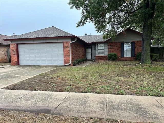 single story home with a garage and a front lawn