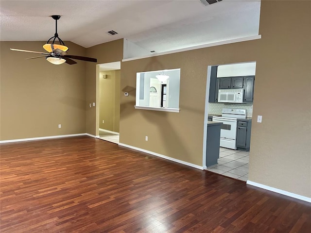 interior space featuring light hardwood / wood-style flooring, ceiling fan, and lofted ceiling