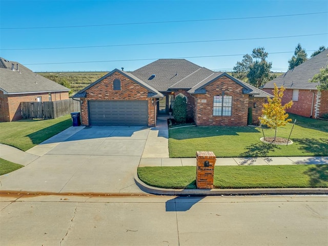 view of front facade featuring a garage and a front lawn