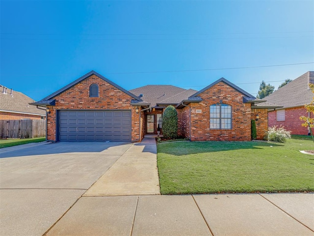 view of front of house with a garage and a front yard