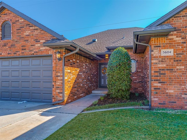 view of exterior entry featuring a garage