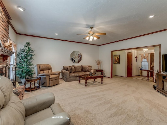 living room featuring light carpet, ceiling fan, ornamental molding, and a brick fireplace