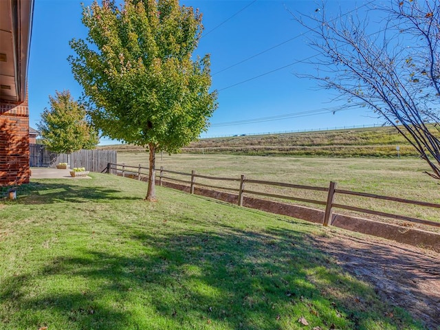 view of yard featuring a patio area and a rural view