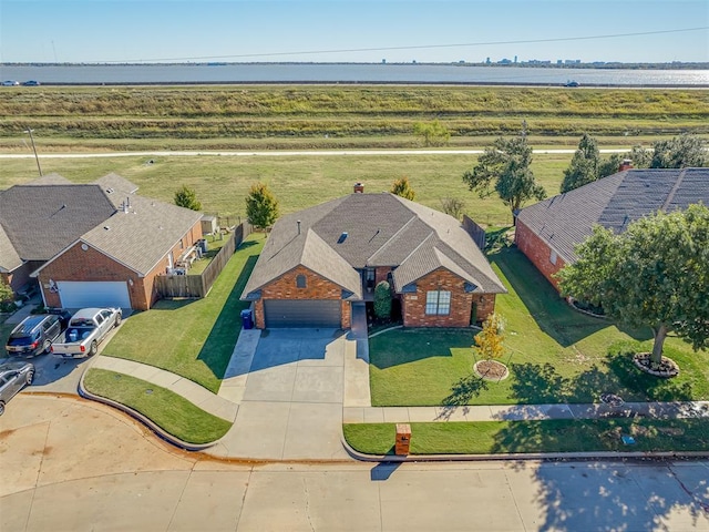 drone / aerial view featuring a water view and a rural view