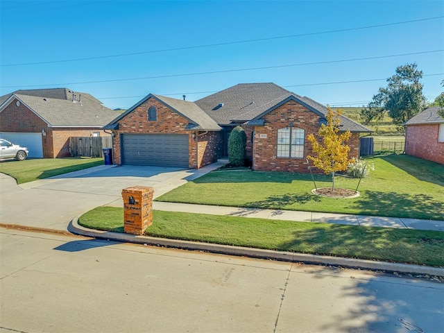 view of front of house featuring a garage and a front yard