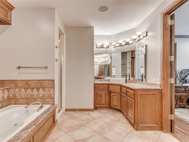 bathroom with tile patterned flooring, vanity, and independent shower and bath