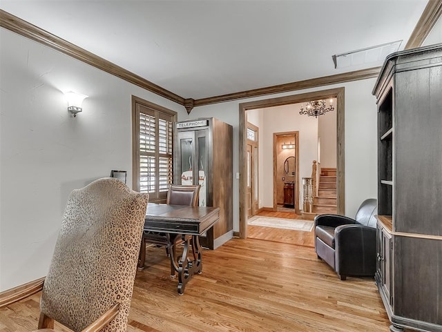 sitting room featuring light hardwood / wood-style flooring and ornamental molding