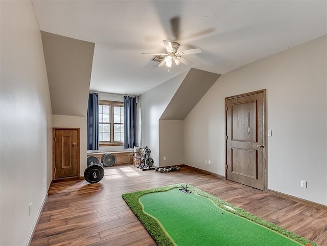 interior space with hardwood / wood-style floors, ceiling fan, and lofted ceiling