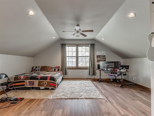 bedroom with hardwood / wood-style flooring, ceiling fan, and lofted ceiling