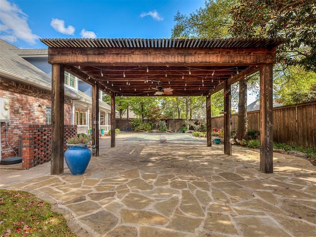 view of patio featuring ceiling fan