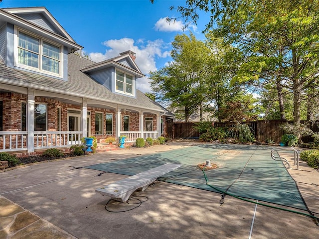 exterior space featuring a covered pool