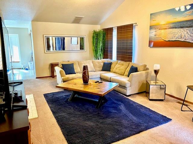 living room featuring light carpet and lofted ceiling