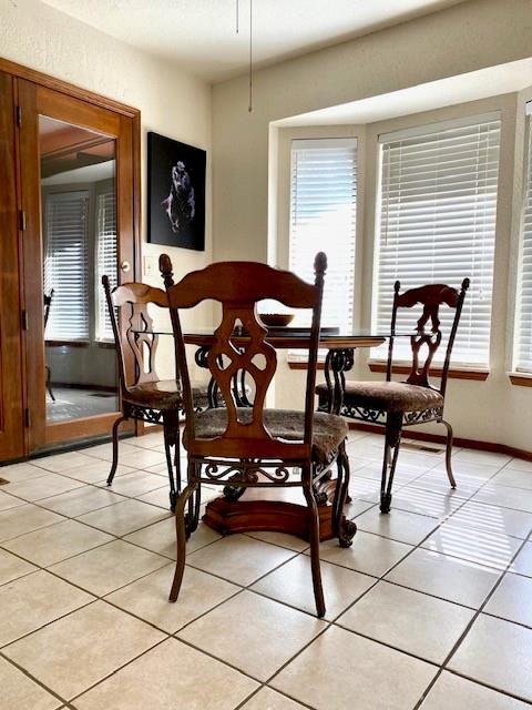 dining room featuring light tile patterned flooring