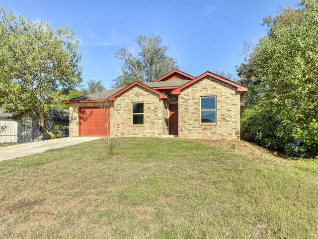 view of front of home featuring a garage and a front lawn