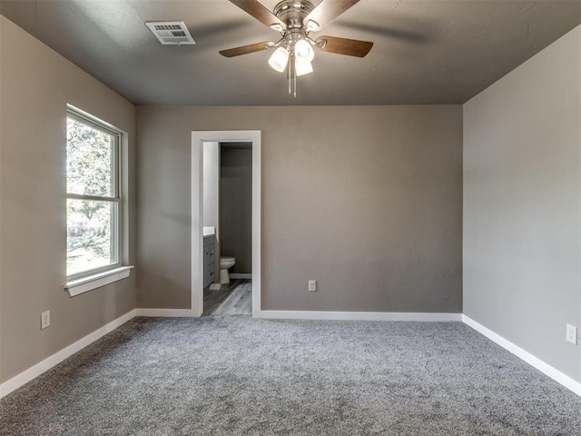 empty room with carpet flooring and ceiling fan