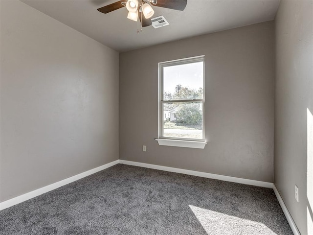 carpeted empty room featuring ceiling fan