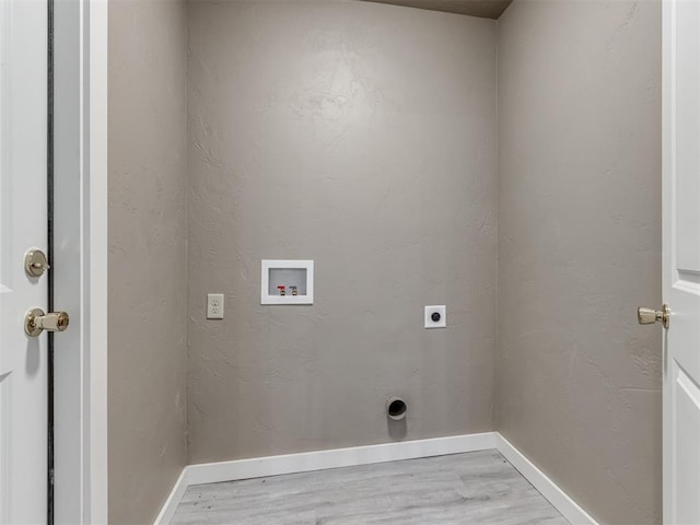 laundry room with hookup for an electric dryer, washer hookup, and light hardwood / wood-style flooring