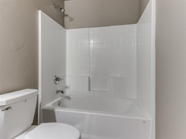 bathroom with toilet and shower / bath combination