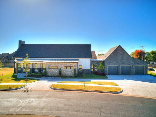 view of front facade with a garage and a front lawn