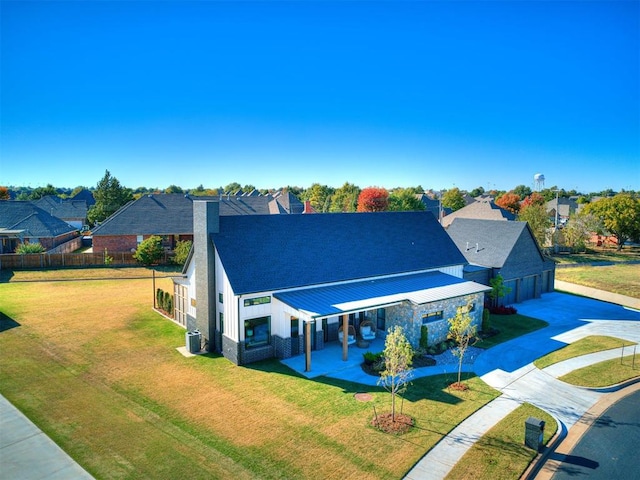 view of front of house featuring a front lawn and cooling unit