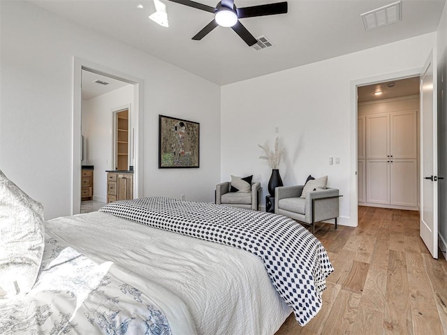 bedroom with ceiling fan and light hardwood / wood-style flooring