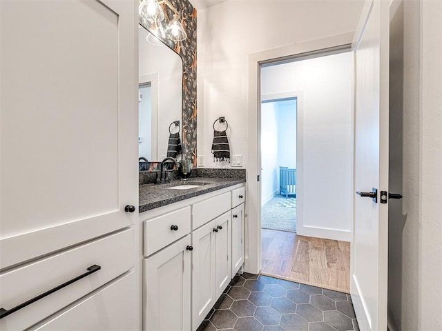 bathroom with vanity and wood-type flooring