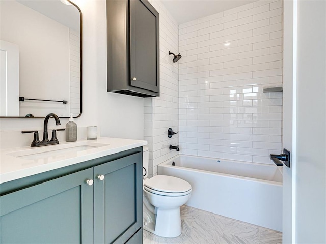 full bathroom featuring vanity, tiled shower / bath combo, and toilet