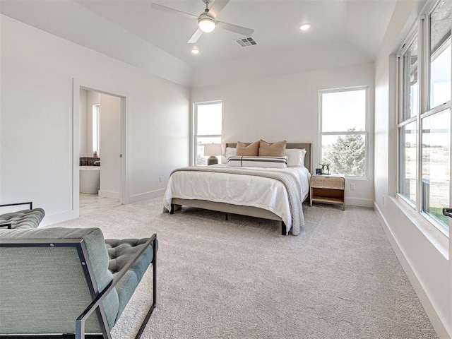 carpeted bedroom featuring ensuite bathroom, ceiling fan, and lofted ceiling