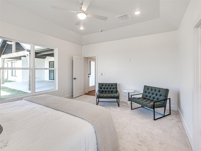 bedroom with ceiling fan and light carpet