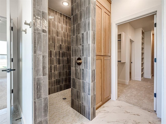 bathroom with tiled shower