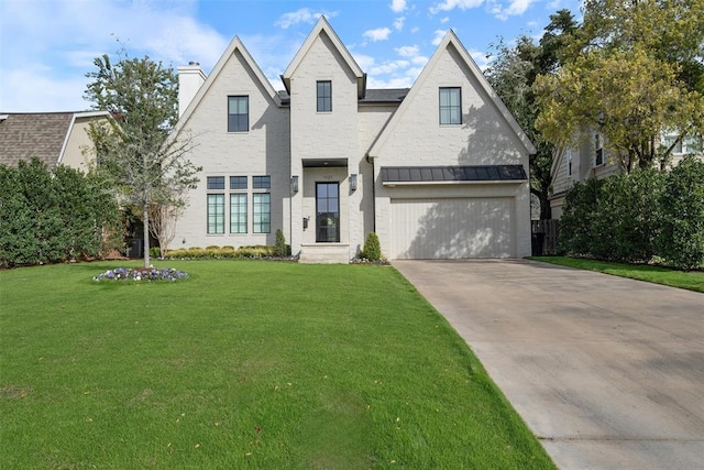 view of front of home featuring a front lawn and a garage