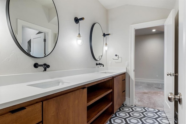 bathroom featuring vanity and vaulted ceiling