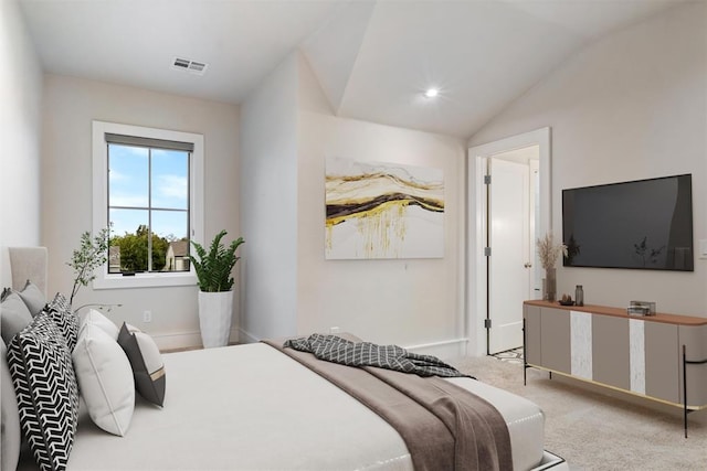 carpeted bedroom featuring vaulted ceiling