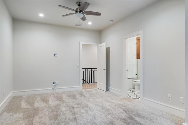 empty room with light carpet and ceiling fan