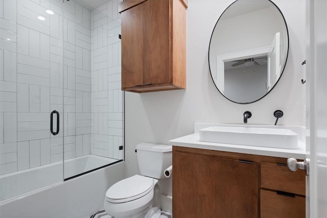 full bathroom featuring vanity, toilet, and combined bath / shower with glass door